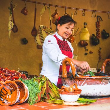 a person sitting at a table with food