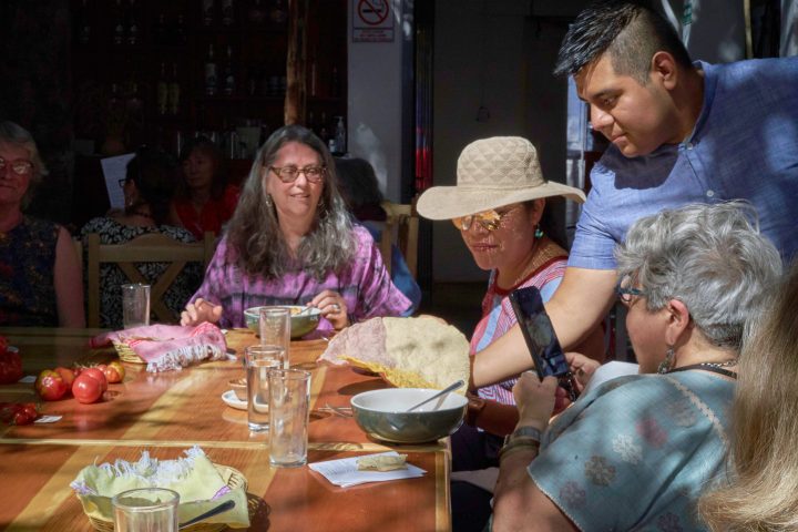 a group of people sitting at a table