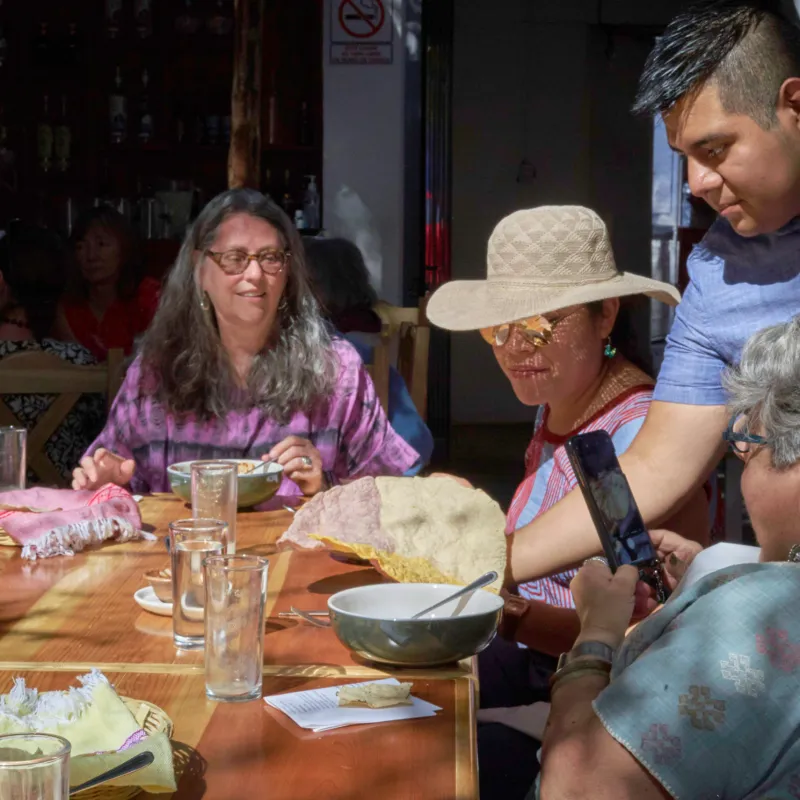 a group of people sitting at a table