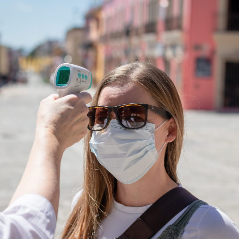 a person wearing sunglasses talking on a cell phone
