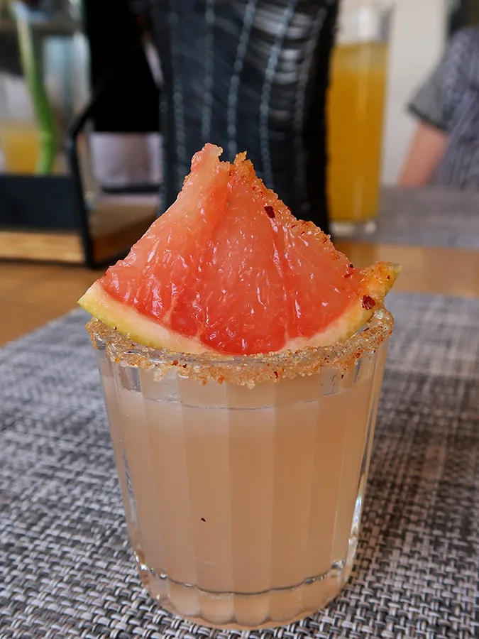 a close up of a glass of orange juice