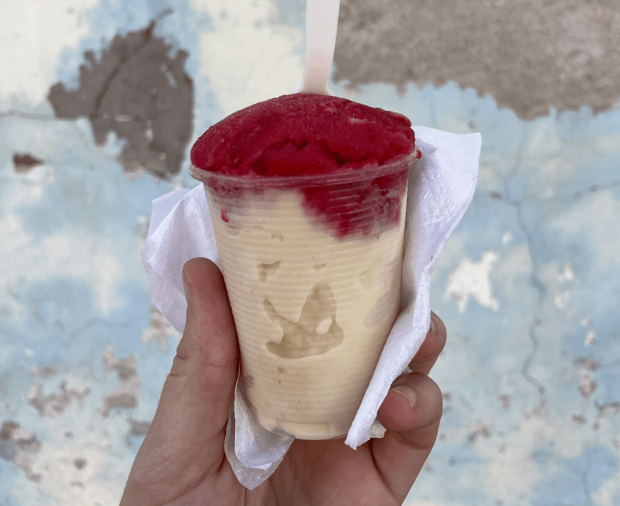 sorbet in a plastic cup with a plastic spoon
